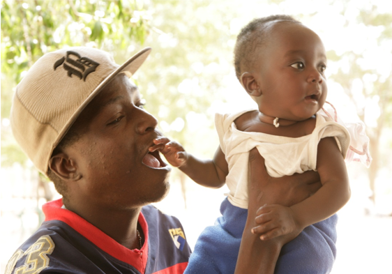 Adult holding a baby