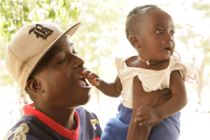 Adult holding a baby