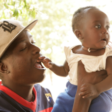 Adult holding a baby