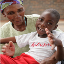 Woman with a small child in her lap